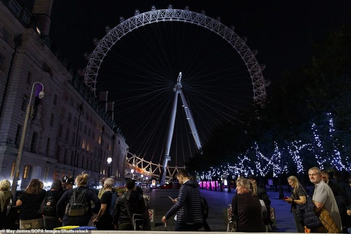 The near five-mile queue stretches far beyond the London Eye (pictured) as thousands wait to pay their final respects to the Queen