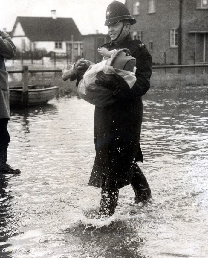 It was one of the worst natural disasters in British history, but most people now have no idea it even happened. Essex's Canvey Island was one of the worst affected parts of the country, with 58 people losing their lives. Above: A policeman carries a child to safety in Canvey Island